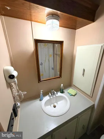 a bedroom with a bed and lamp