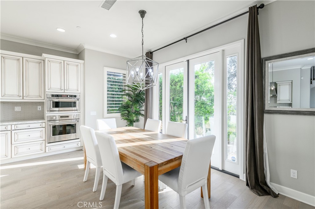 126 Long Fence Irvine, CA 92602 - Photo 13 of 61 a view of a dining room with furniture window and outside view