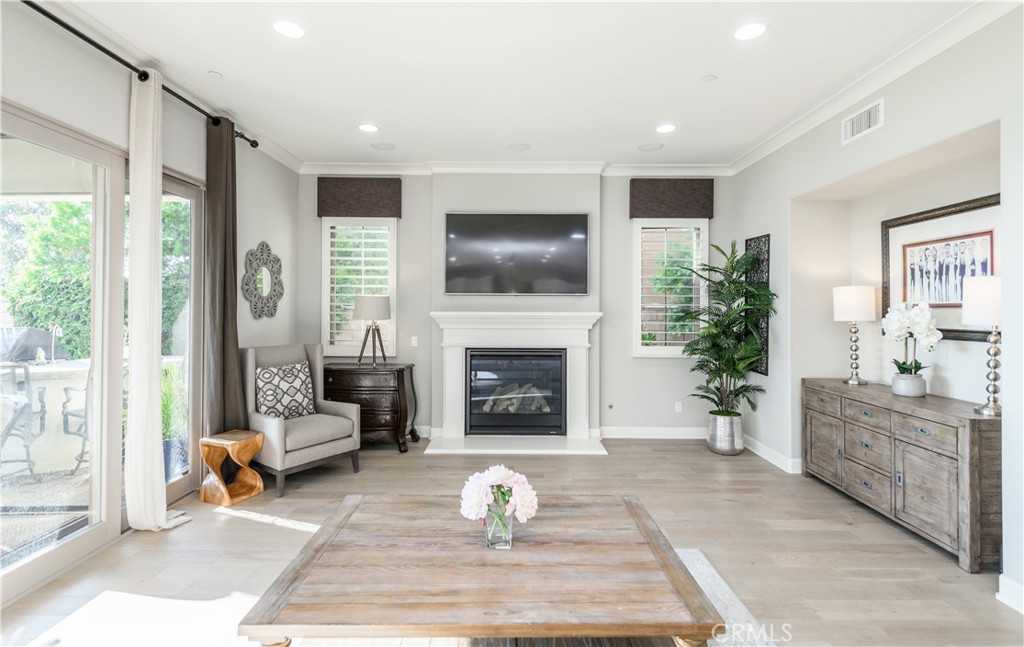 126 Long Fence Irvine, CA 92602 - Photo 14 of 61 a living room with furniture and a fireplace