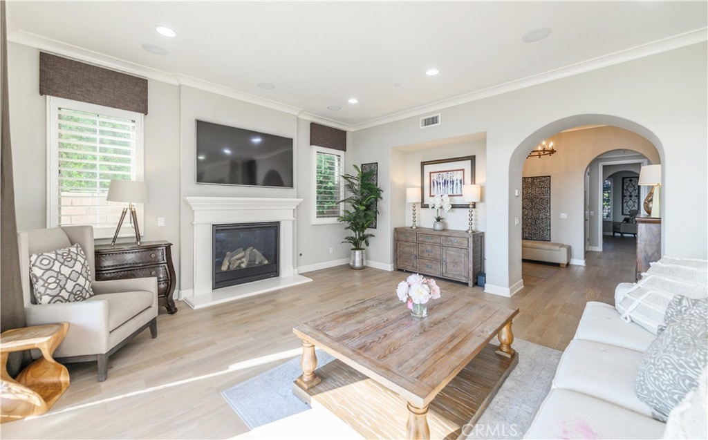 126 Long Fence Irvine, CA 92602 - Photo 16 of 61 a living room with furniture and a fireplace