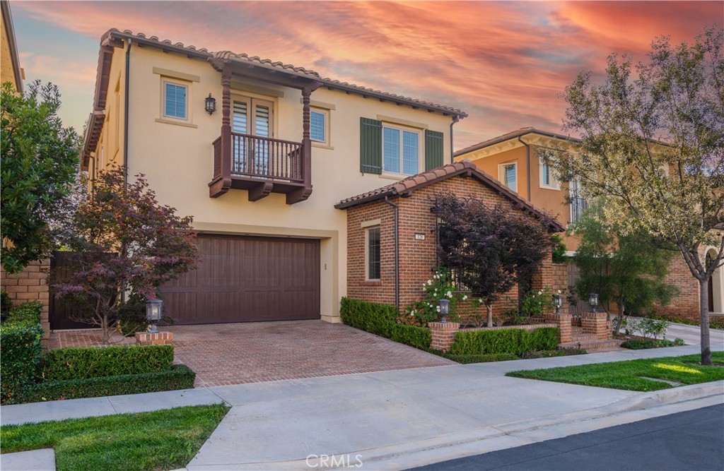 126 Long Fence Irvine, CA 92602 - Photo 2 of 61 a front view of a house with a yard and a garage