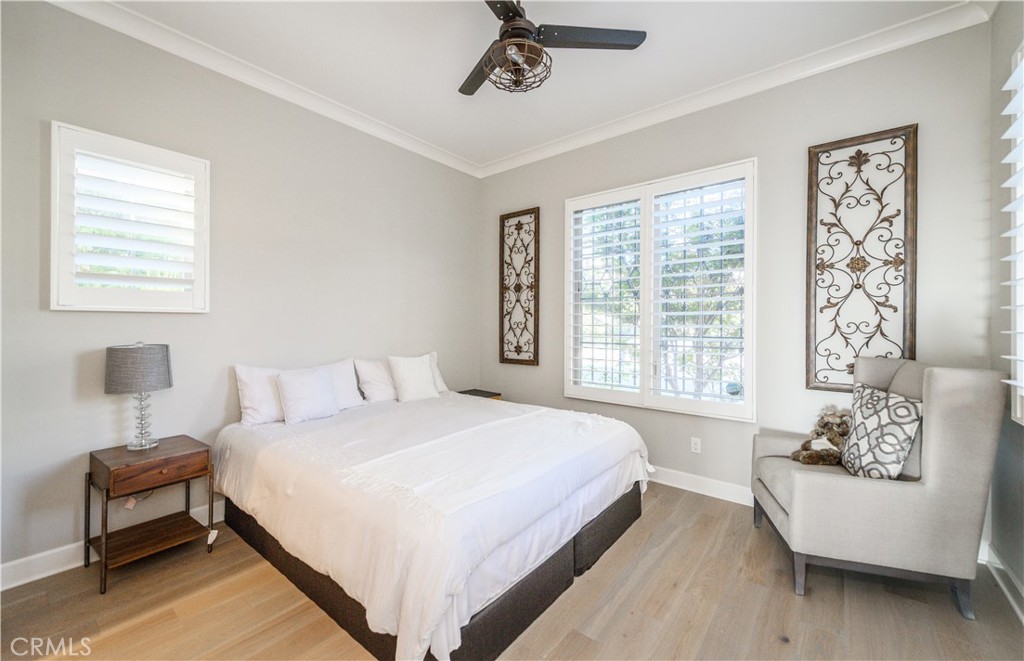 126 Long Fence Irvine, CA 92602 - Photo 30 of 61 a bedroom with a bed and a couch