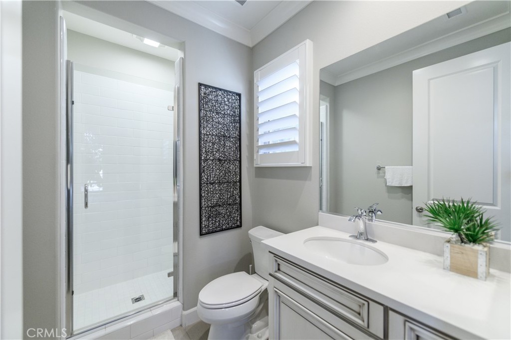 126 Long Fence Irvine, CA 92602 - Photo 31 of 61 a bathroom with a sink toilet and shower