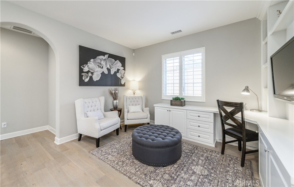 126 Long Fence Irvine, CA 92602 - Photo 32 of 61 a living room with furniture and a flat screen tv