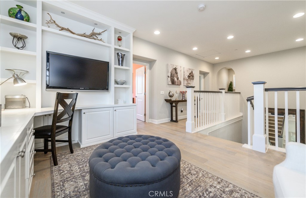 126 Long Fence Irvine, CA 92602 - Photo 34 of 61 a living room with furniture and a flat screen tv