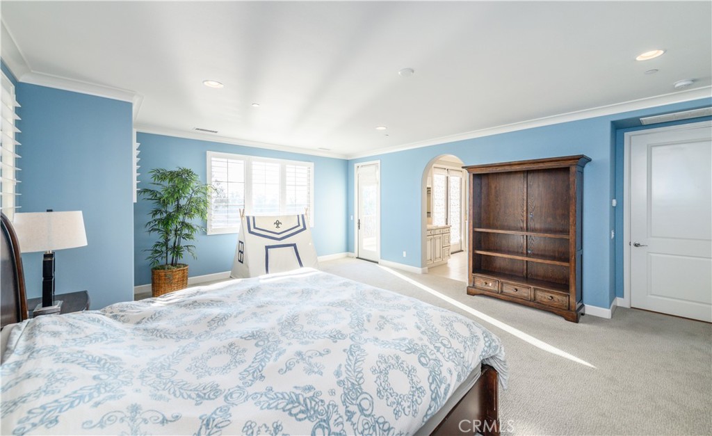 126 Long Fence Irvine, CA 92602 - Photo 37 of 61 a bedroom with a bed and a large window