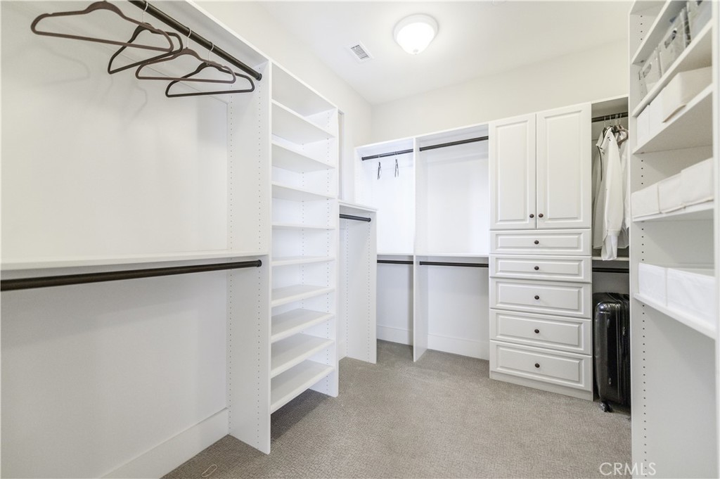 126 Long Fence Irvine, CA 92602 - Photo 43 of 61 a view of walk in closet with empty racks