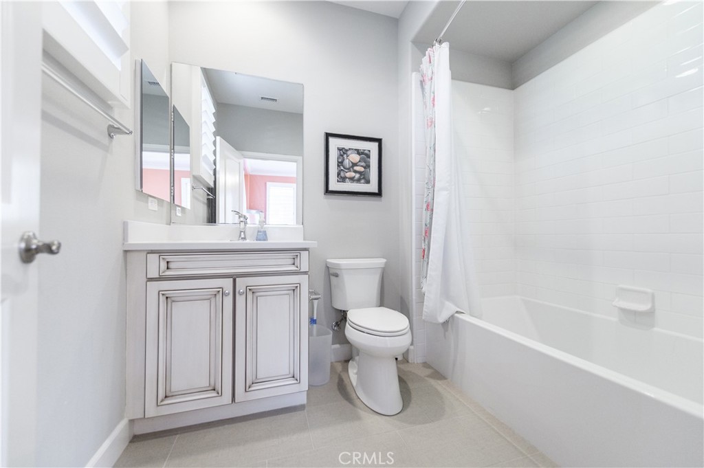 126 Long Fence Irvine, CA 92602 - Photo 45 of 61 a bathroom with a sink toilet and vanity