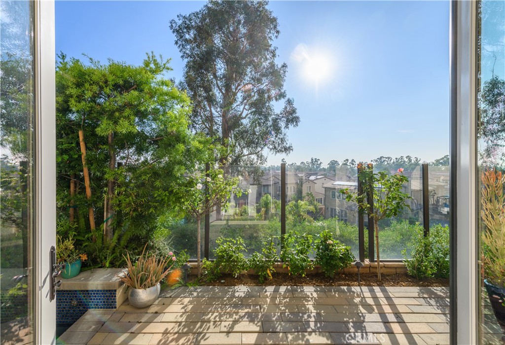 126 Long Fence Irvine, CA 92602 - Photo 51 of 61 a view of a garden with plants and a bench