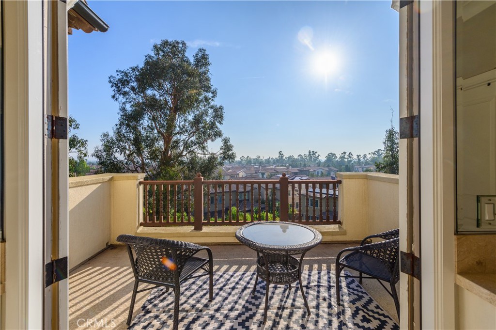 126 Long Fence Irvine, CA 92602 - Photo 58 of 61 a view of balcony with wooden floor and outdoor seating