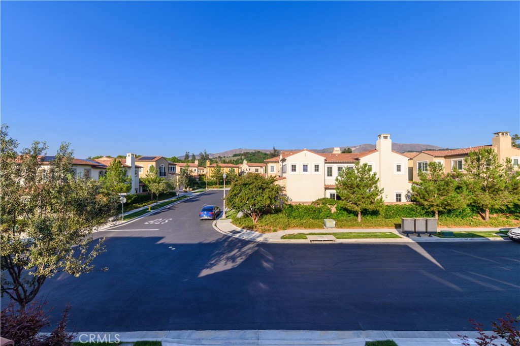 126 Long Fence Irvine, CA 92602 - Photo 60 of 61 a view of a street with a yard