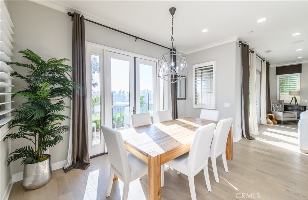 126 Long Fence Irvine, CA 92602 - Photo 7 of 61 a view of a dining room with furniture window and wooden floor