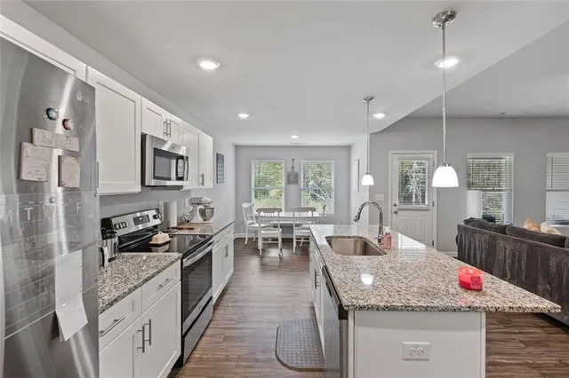 a dining room with furniture and window
