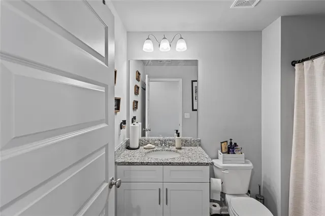 a bathroom with a shower and a shower curtain