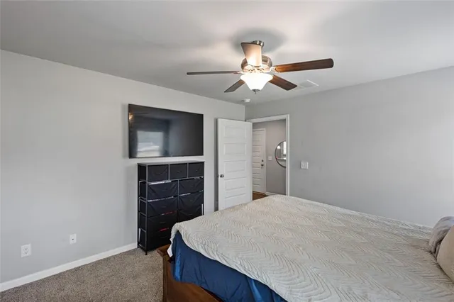 a bathroom with a granite countertop sink a mirror and a shower