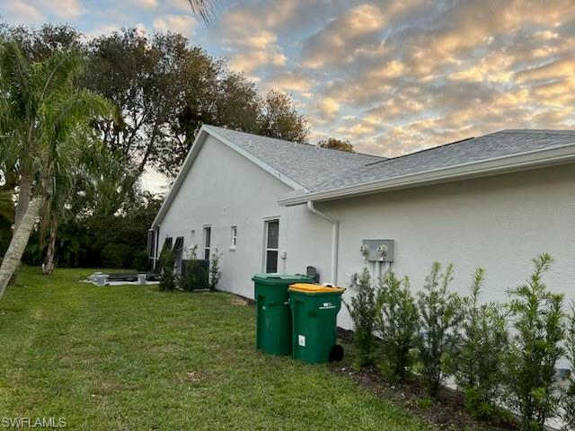 480 St Andrews Boulevard, Unit 14 Naples, FL 34113 - Photo 22 of 24 a view of a house with backyard and garden