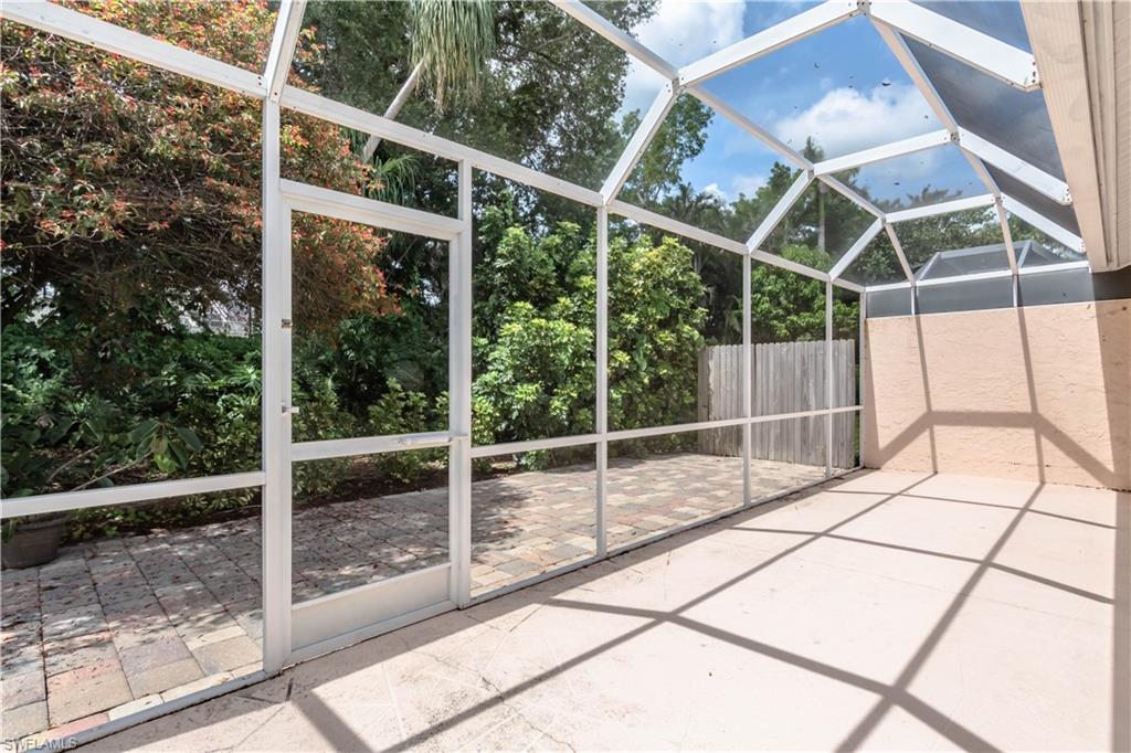 480 St Andrews Boulevard, Unit 14 Naples, FL 34113 - Photo 23 of 24 a view of outdoor space with backyard