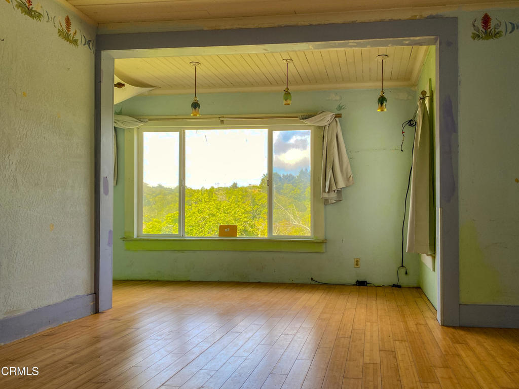 42000 Mountain View Road Manchester, CA 95459 - Photo 32 of 54 a view of empty room with wooden floor and fan