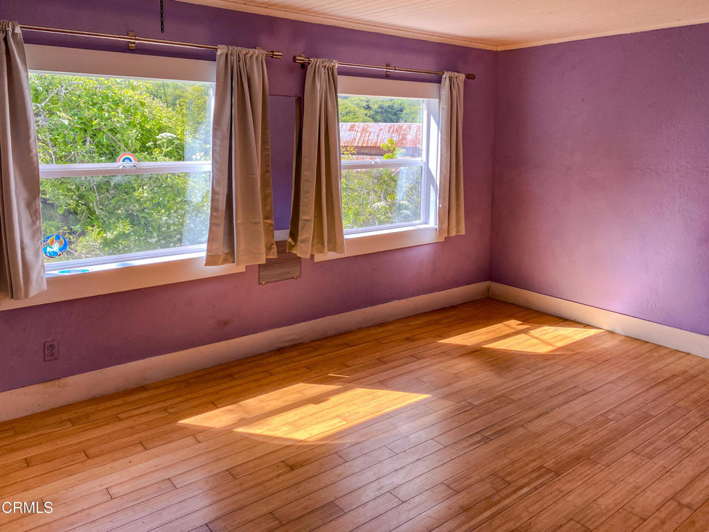 42000 Mountain View Road Manchester, CA 95459 - Photo 33 of 54 a view of empty room with wooden floor and fan