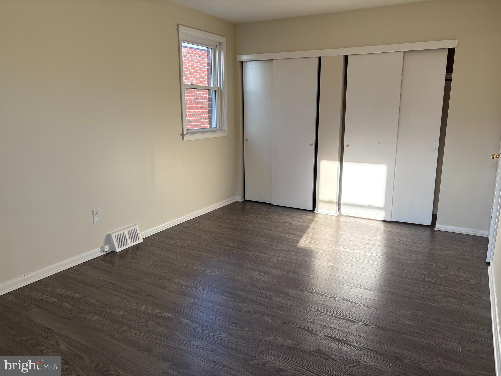 261 Ridgeway Terrace Philadelphia, PA 19116 - Photo 11 of 15 an empty room with wooden floor and windows