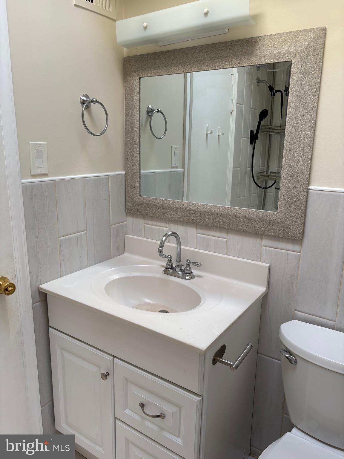 261 Ridgeway Terrace Philadelphia, PA 19116 - Photo 15 of 15 a bathroom with a sink a toilet and mirror