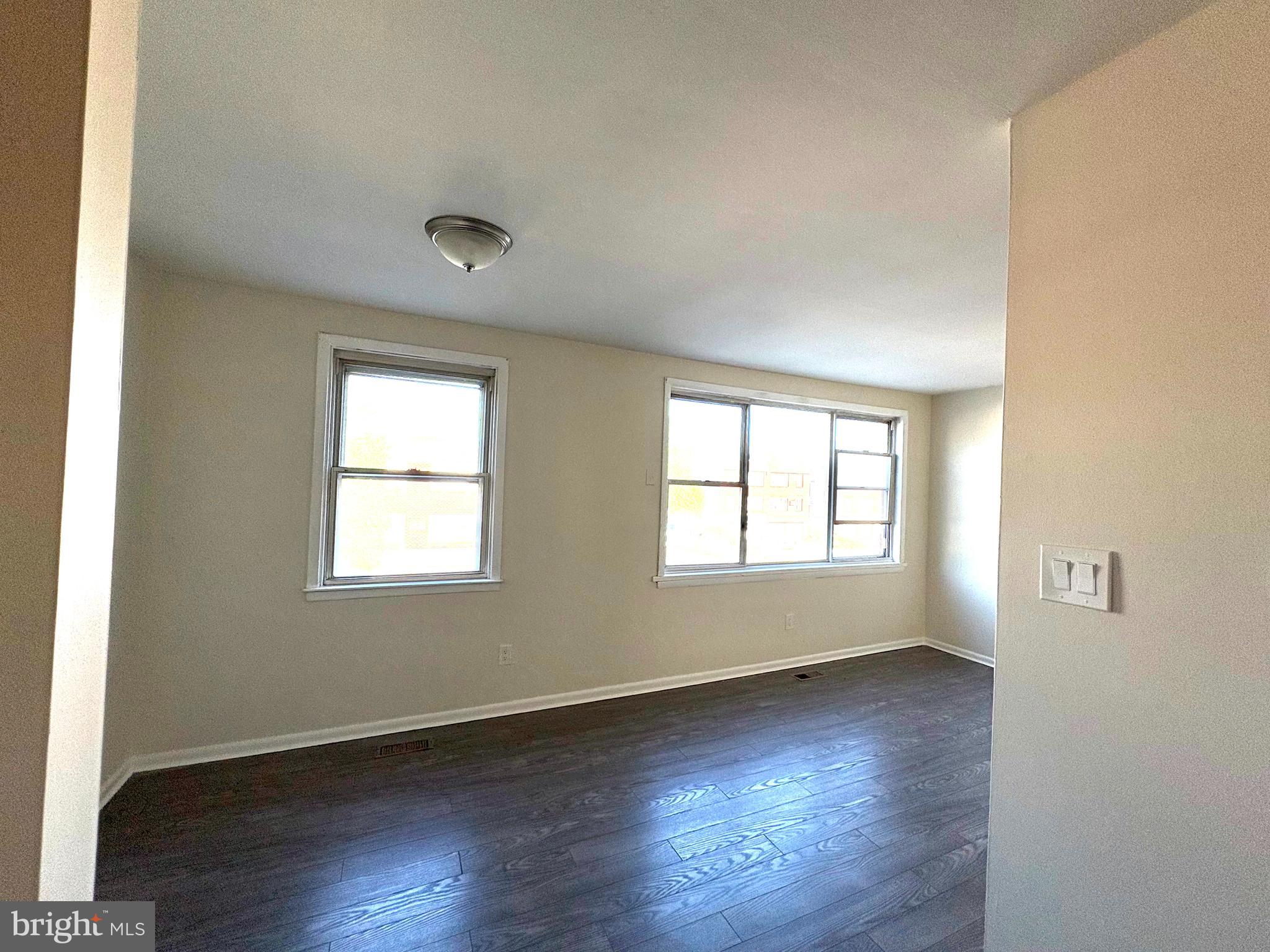 261 Ridgeway Terrace Philadelphia, PA 19116 - Photo 3 of 15 an empty room with wooden floor and windows