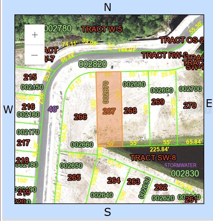 1241 Butterfly Orchid Road Davenport, FL 33837 - Photo 4 of 4 a picture of a floor to ceiling window with a flat screen tv