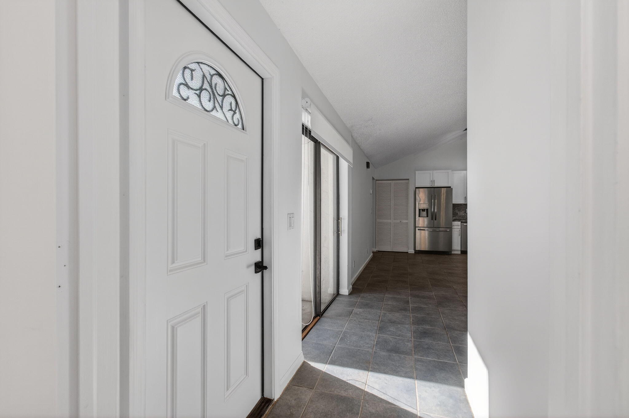 1350 Periwinkle Place Wellington, FL 33414 - Photo 3 of 49 a view of a hallway with a hallway