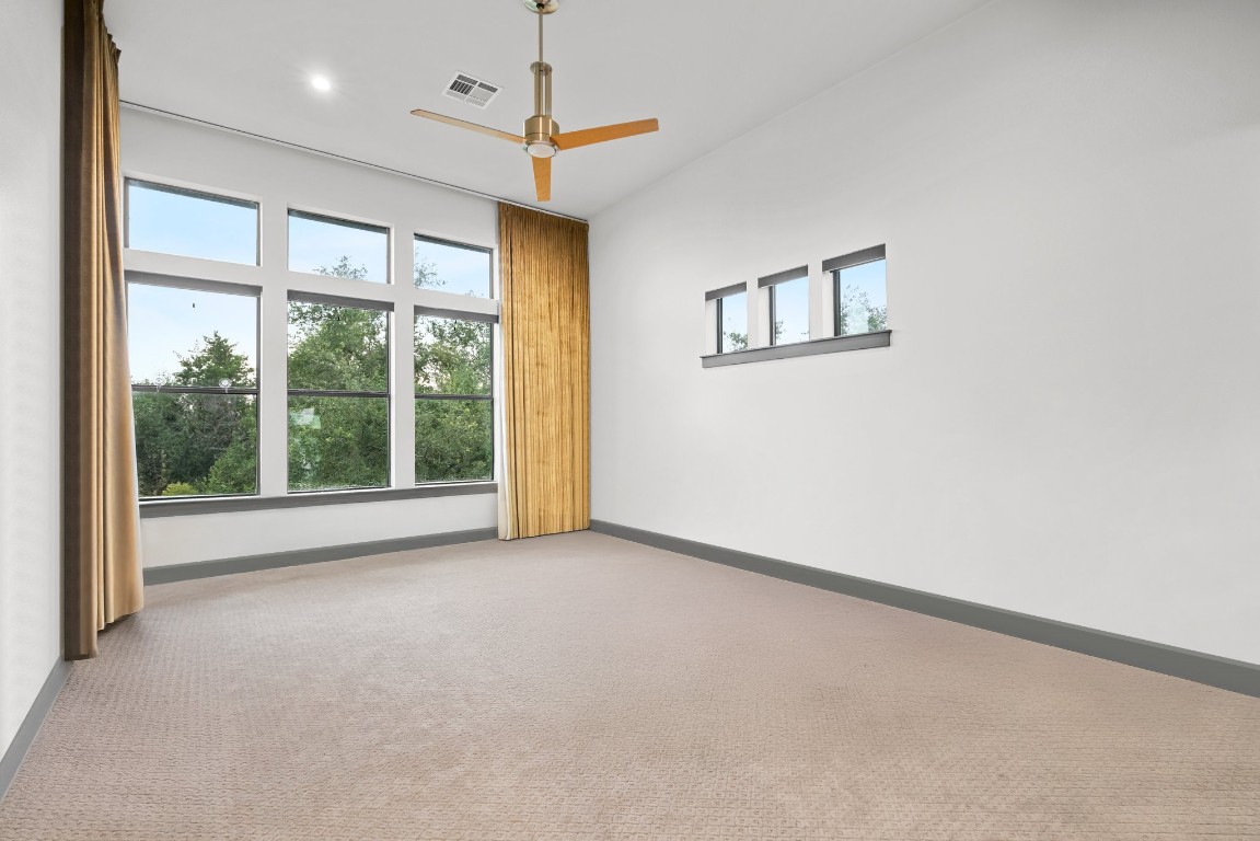332 Rugged Earth Drive, Unit 1 Austin, TX 78737 - Photo 13 of 32 a view of an empty room with a window