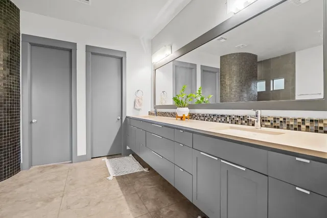 a bathroom with a sink and a mirror