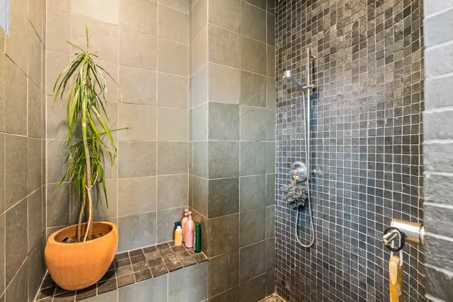 a bathroom with a sink and blue shower
