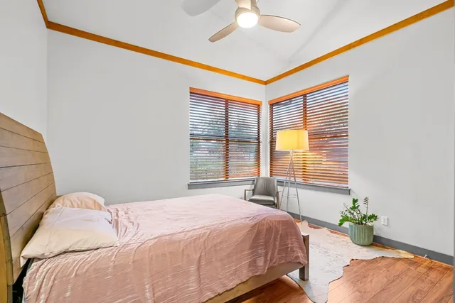 a bedroom with bed and window