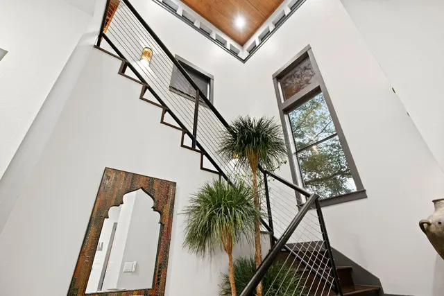 a view of balcony with wooden floor and a potted plant