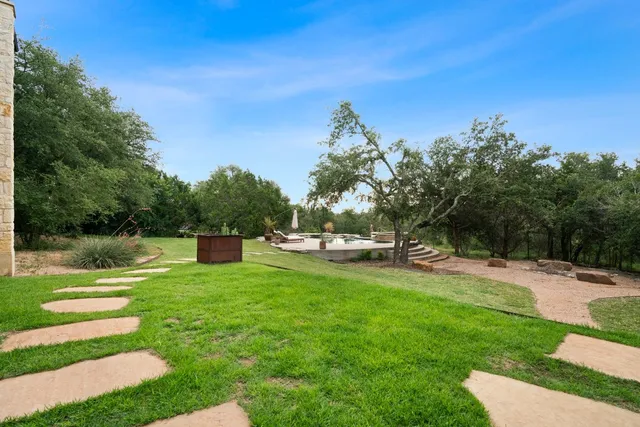 a view of a swimming pool with a patio