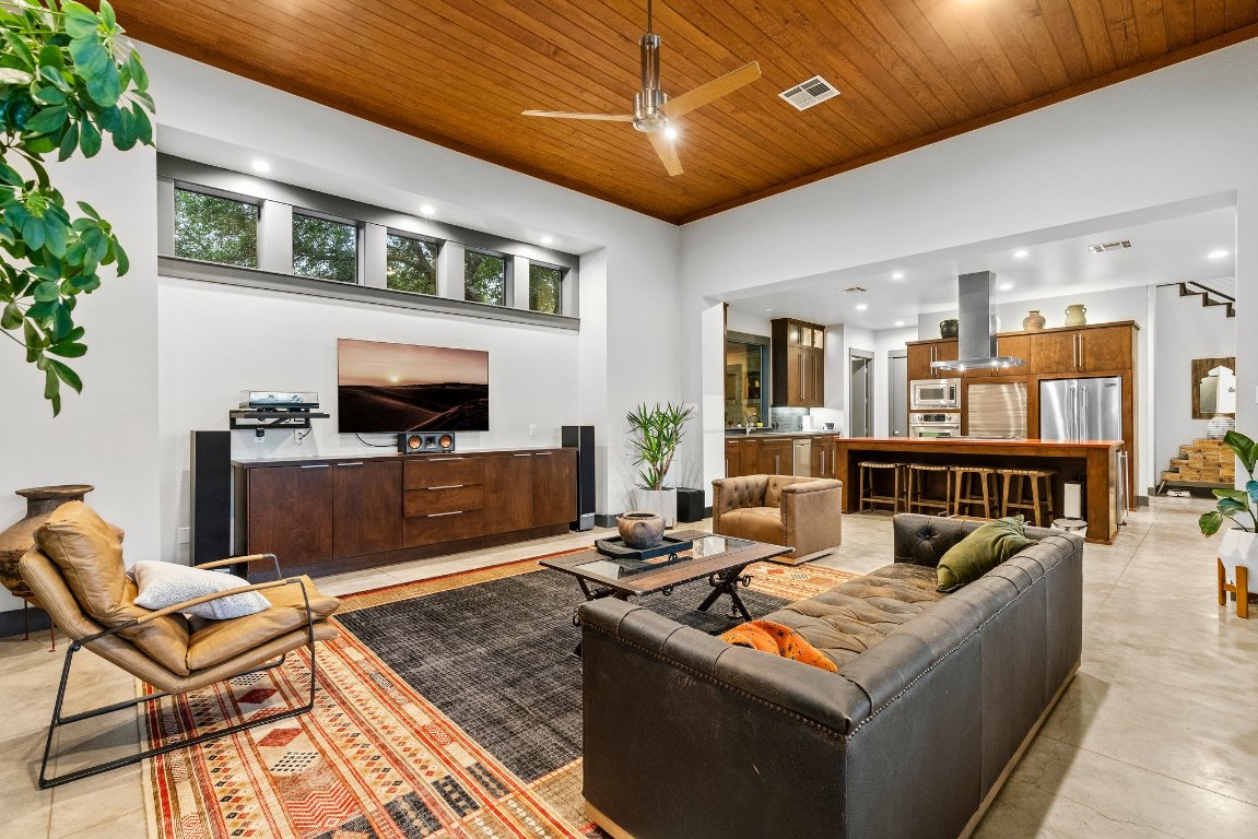 332 Rugged Earth Drive, Unit 1 Austin, TX 78737 - Photo 7 of 32 a living room with fireplace furniture and a flat screen tv