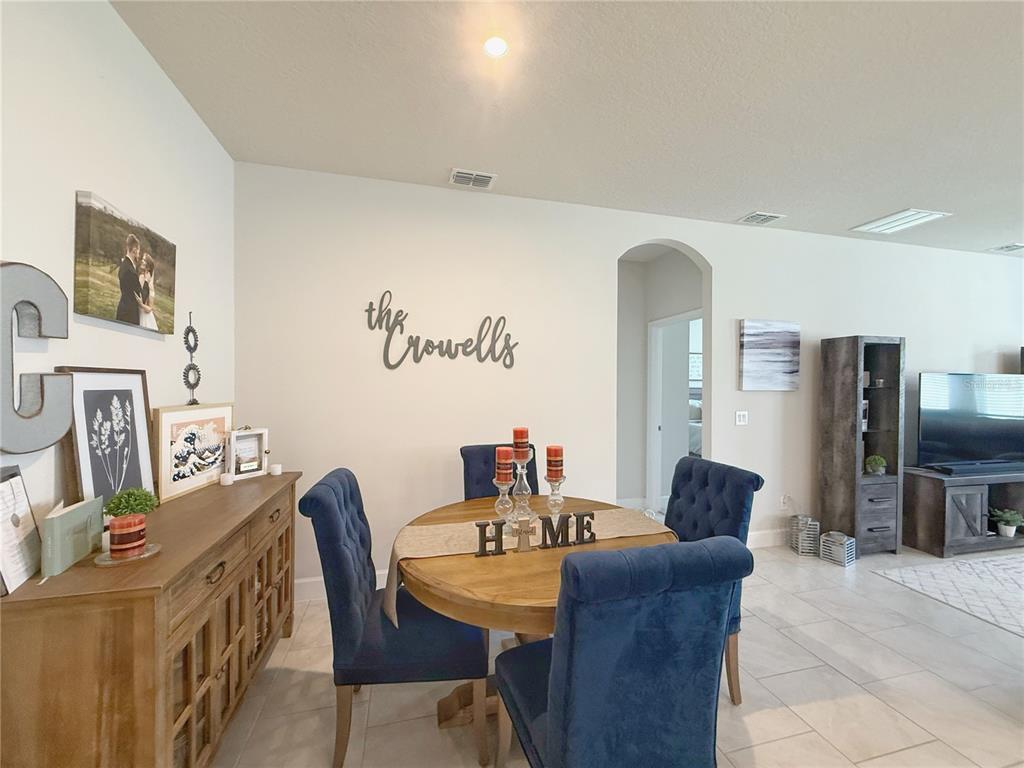 3181 Hill Point Street Minneola, FL 34715 - Photo 11 of 52 a dining room with furniture and window