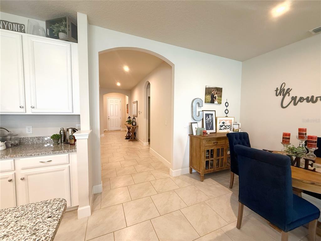 3181 Hill Point Street Minneola, FL 34715 - Photo 14 of 52 a living room with furniture and a wooden floor