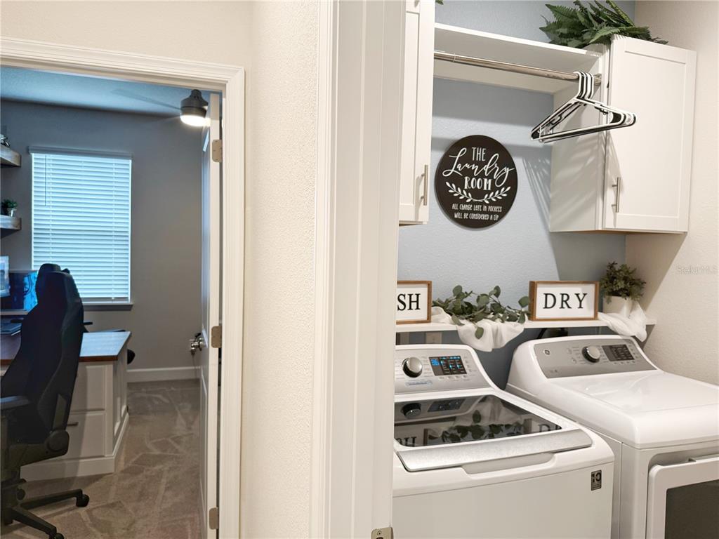 3181 Hill Point Street Minneola, FL 34715 - Photo 37 of 52 a view of washer and dryer