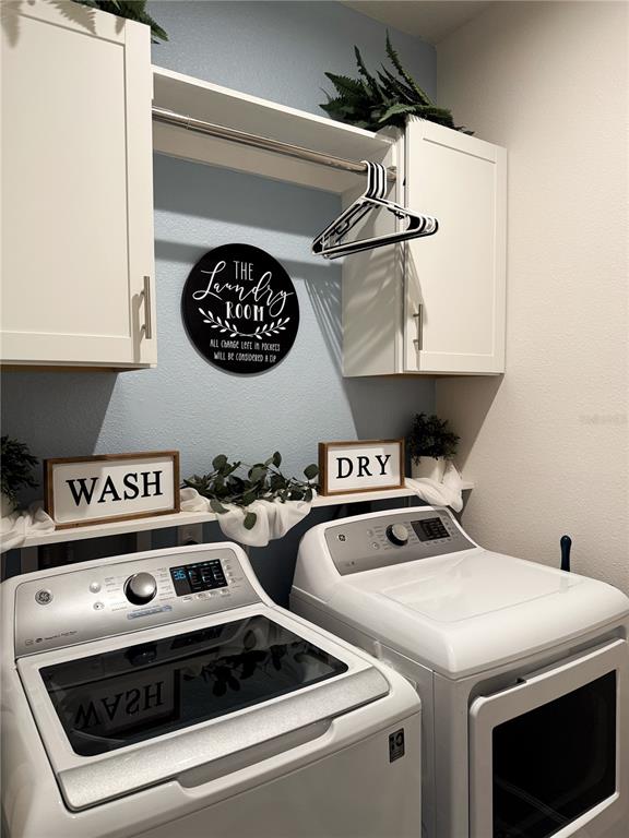 3181 Hill Point Street Minneola, FL 34715 - Photo 41 of 52 a utility room with washer and dryer