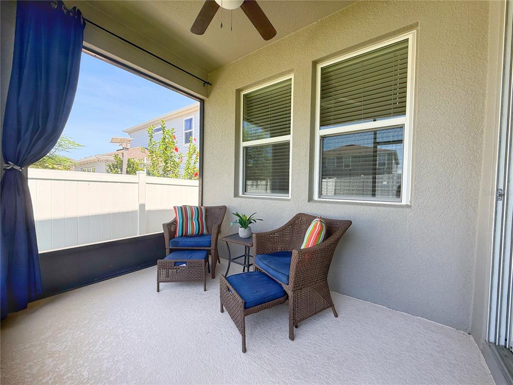 3181 Hill Point Street Minneola, FL 34715 - Photo 42 of 52 a living room with furniture and a window