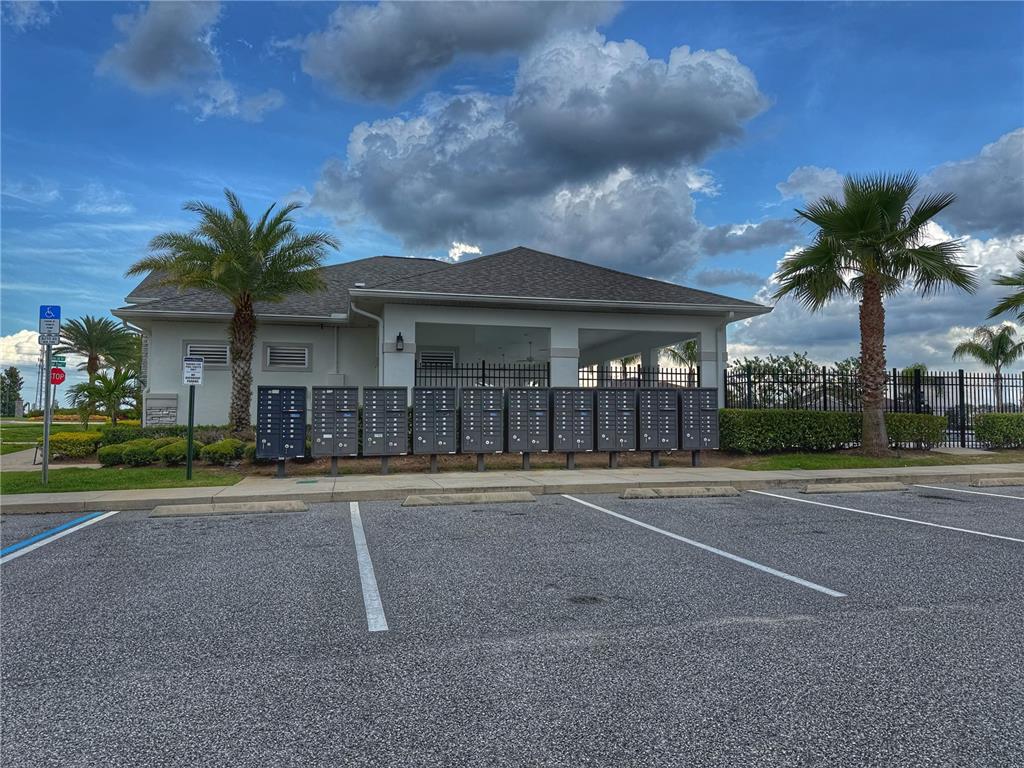 3181 Hill Point Street Minneola, FL 34715 - Photo 50 of 52 front view of a house with a yard