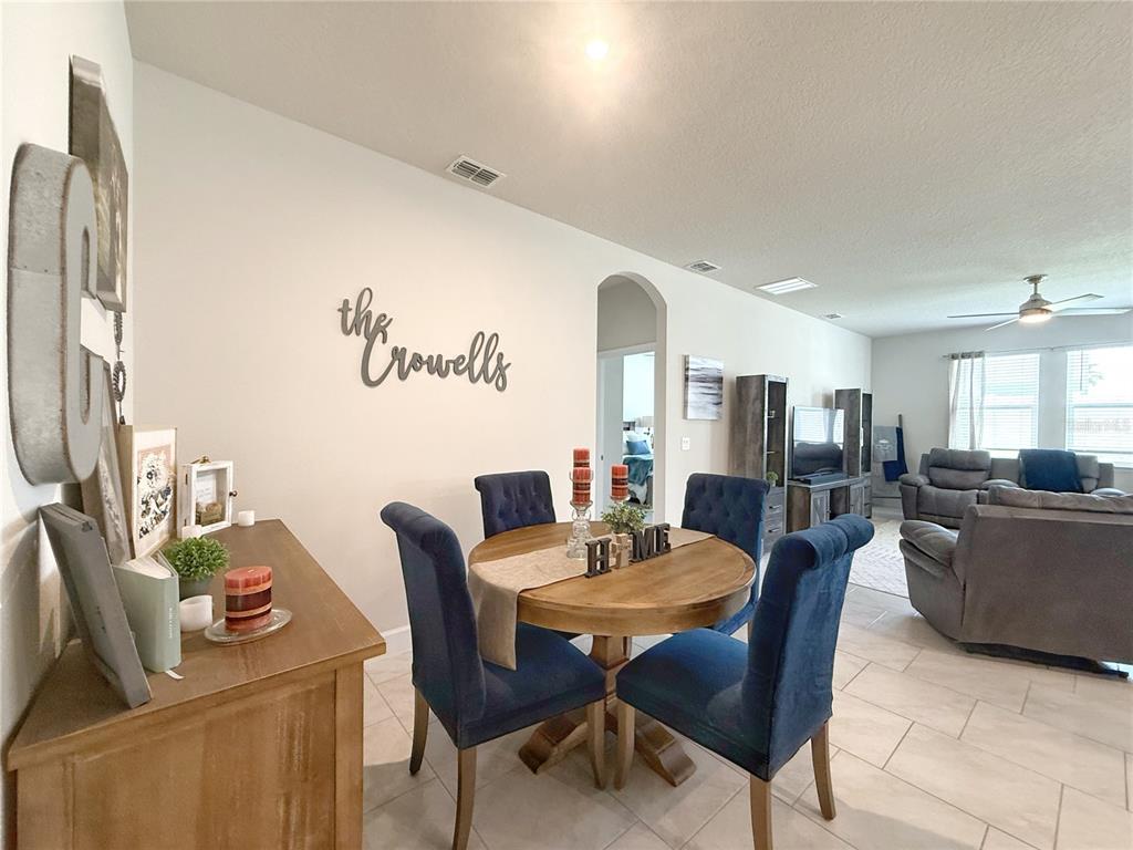 3181 Hill Point Street Minneola, FL 34715 - Photo 9 of 52 a view of a dining room with furniture
