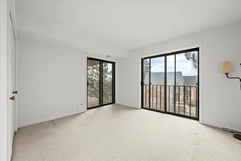 a bathroom with a granite countertop sink a toilet a mirror and shower