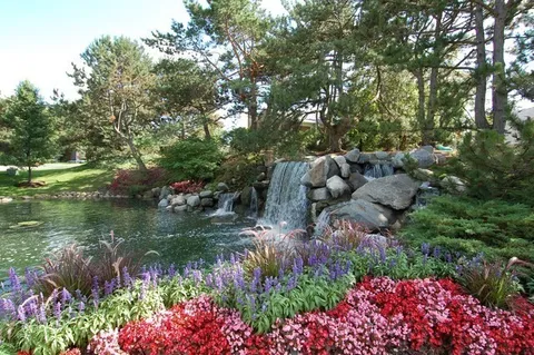 a view of a lake with a house in the background
