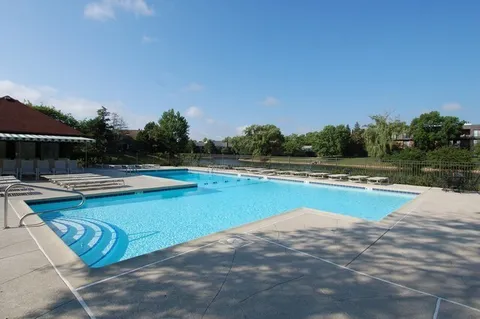 an aerial view of lake residential house with outdoor space and river