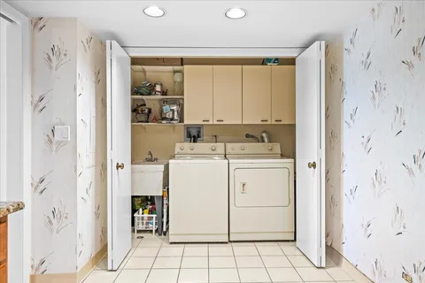 a utility room with dryer and washer