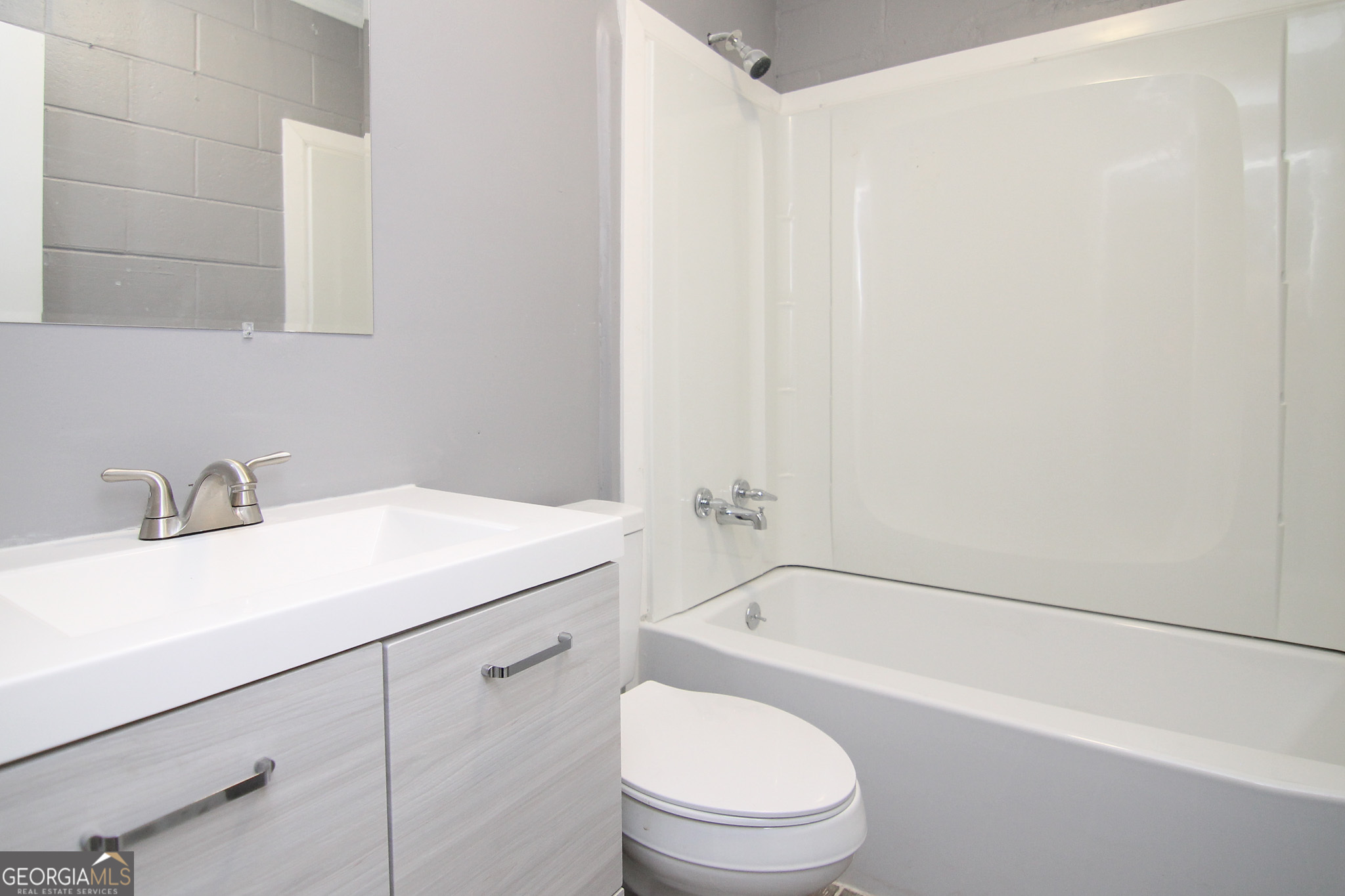 708 South 3rd Street Warner Robins, GA 31088 - Photo 23 of 29 a bathroom with a sink toilet and shower