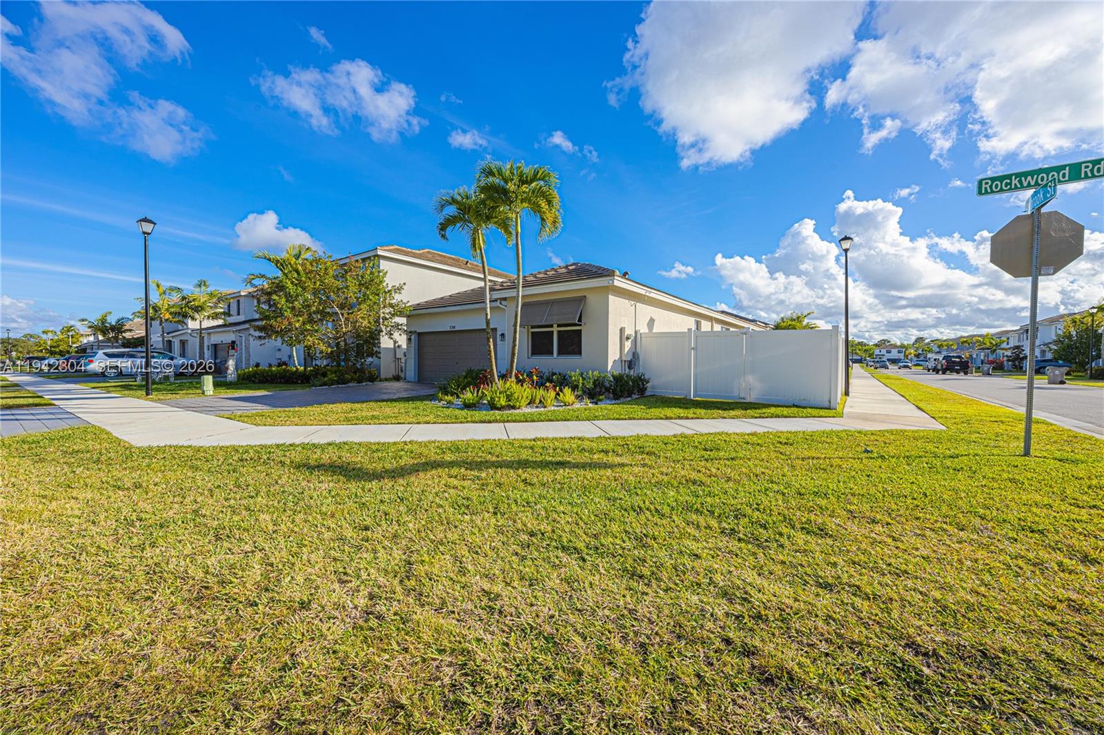 7214 Rockwood Road Jupiter, FL 33458 - Photo 3 of 28 a view of a house with a big yard