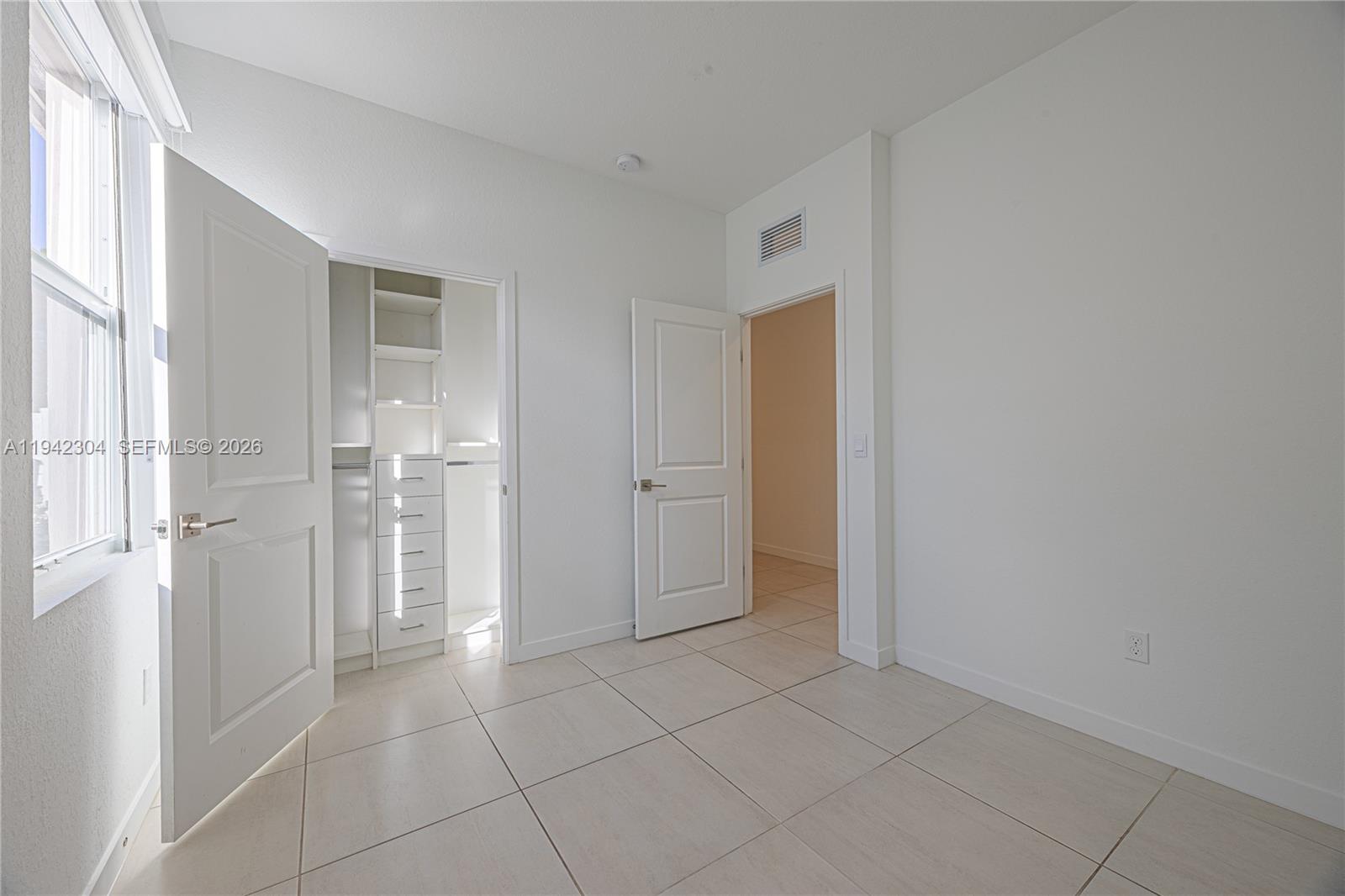 7214 Rockwood Road Jupiter, FL 33458 - Photo 8 of 28 a view of an empty room and closet area