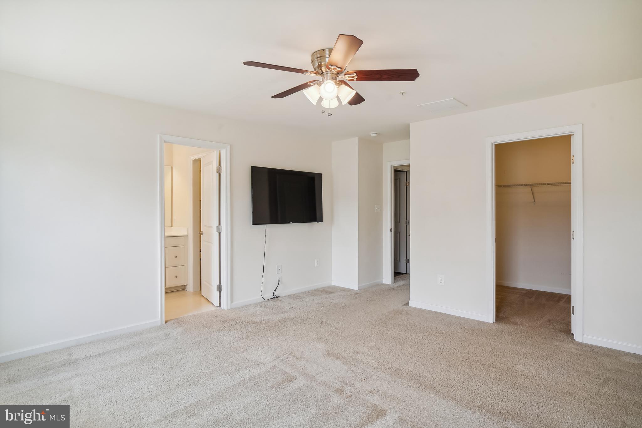 5934 Jefferson Commons Way Frederick, MD 21703 - Photo 15 of 27 a view of an empty room with a ceiling fan